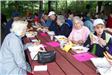 Seniors Eating at an Outdoor Picnic 3