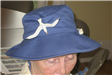 Woman Wearing Blue Hat with Birds