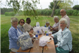 Group of Women Sitting with Food 2