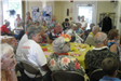 Group Sitting at Yellow Table