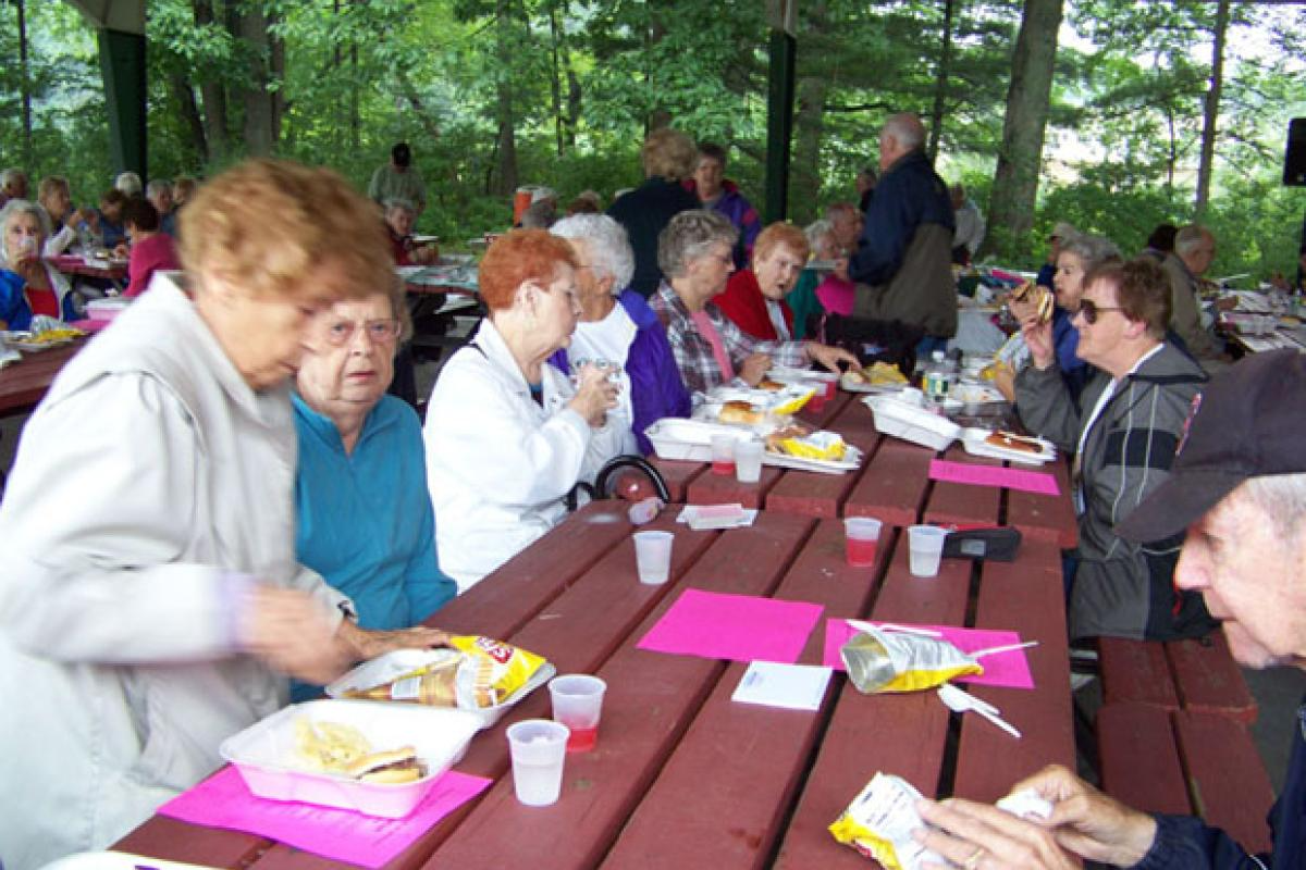 Seniors Eating at an Outdoor Picnic 1