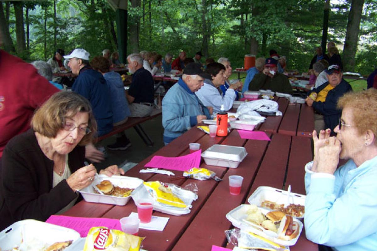 Seniors Eating at an Outdoor Picnic 2