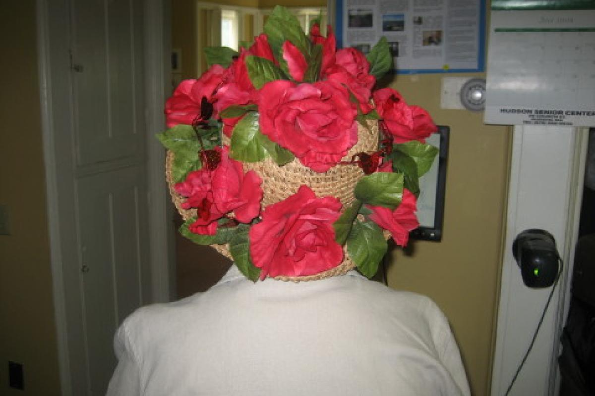 Woman Wearing Hat with Red Flowers, Back View