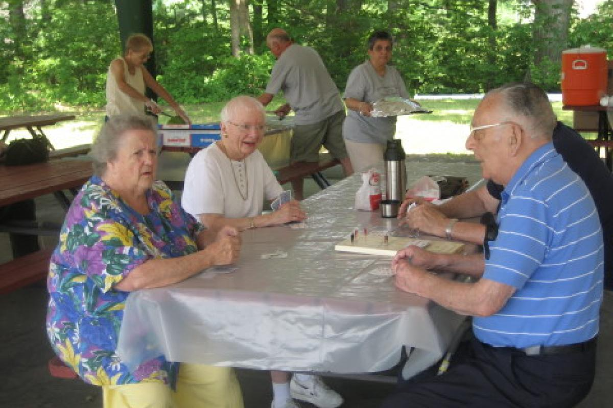 Seniors Sitting at Picnic Table