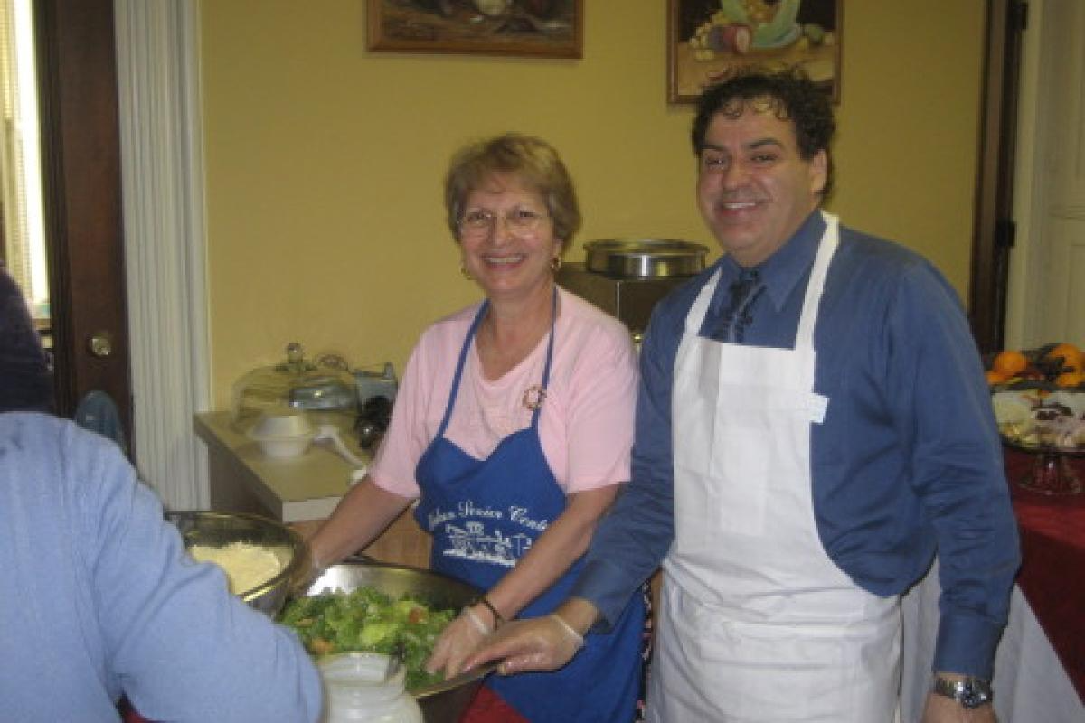People Smiling and Making Food
