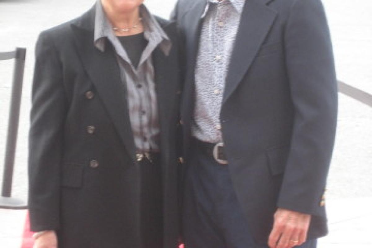 Woman and Man Dressed in Black Suits