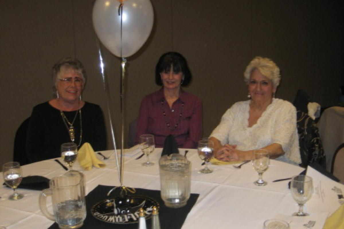 Three Women Sitting and Smiling 2