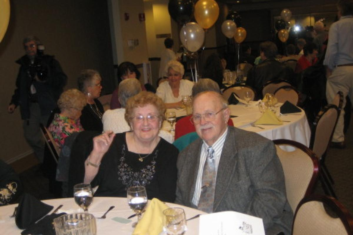 Two People Sitting and Smiling 2