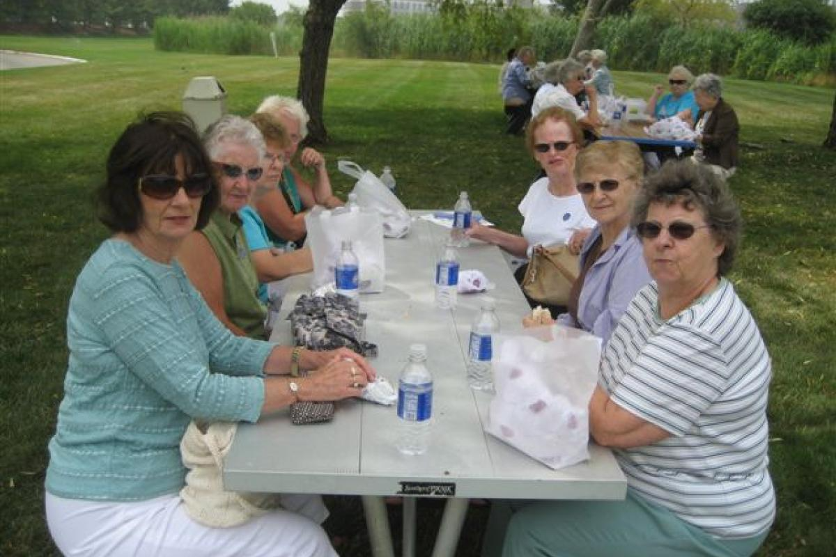 Group of Women Sitting with Food 4