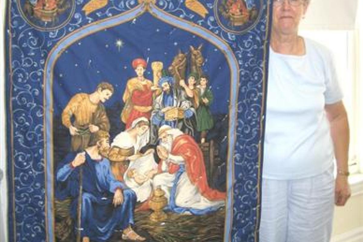 Woman Holding Cloth with Religious Print