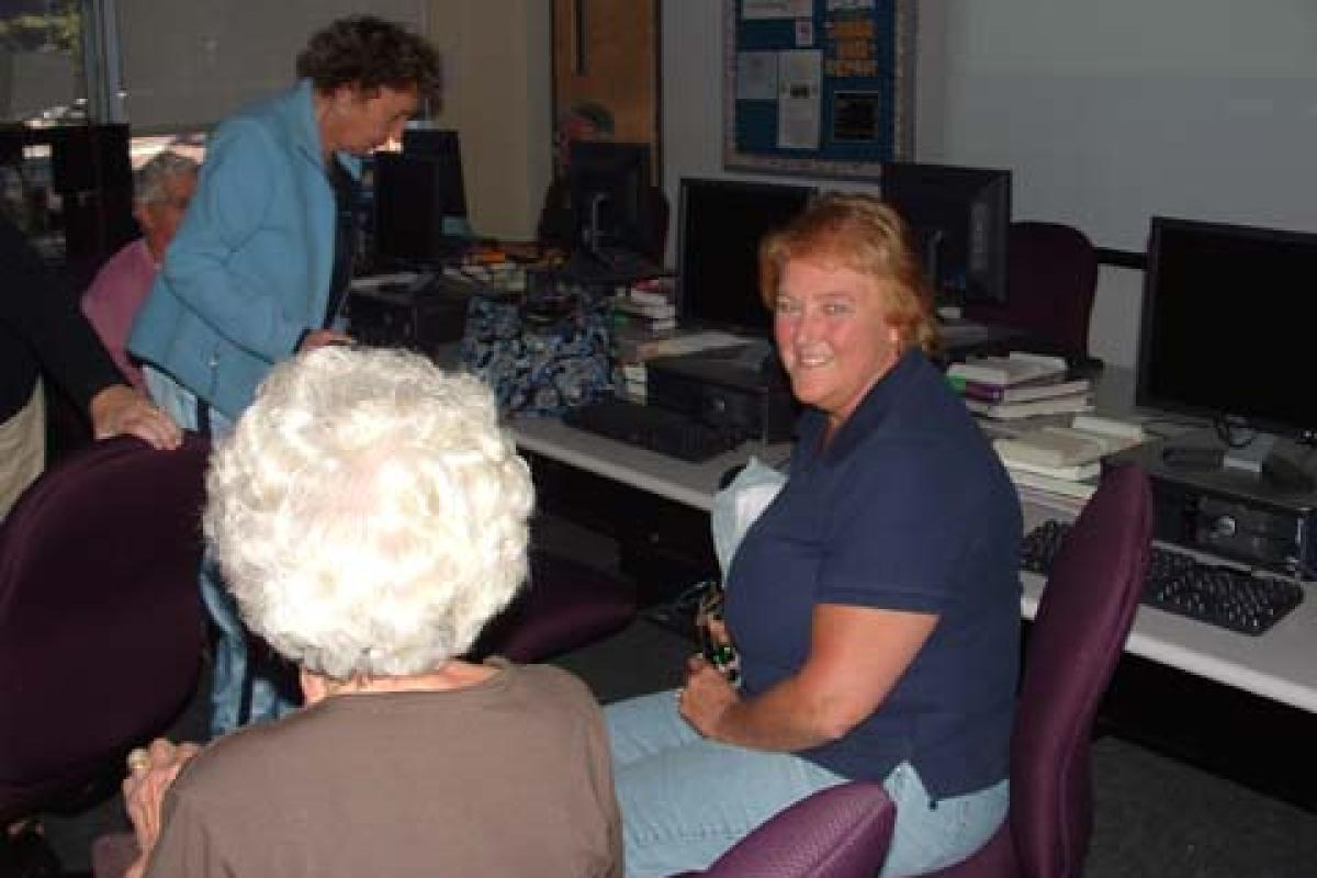 Woman Smiling and Sitting
