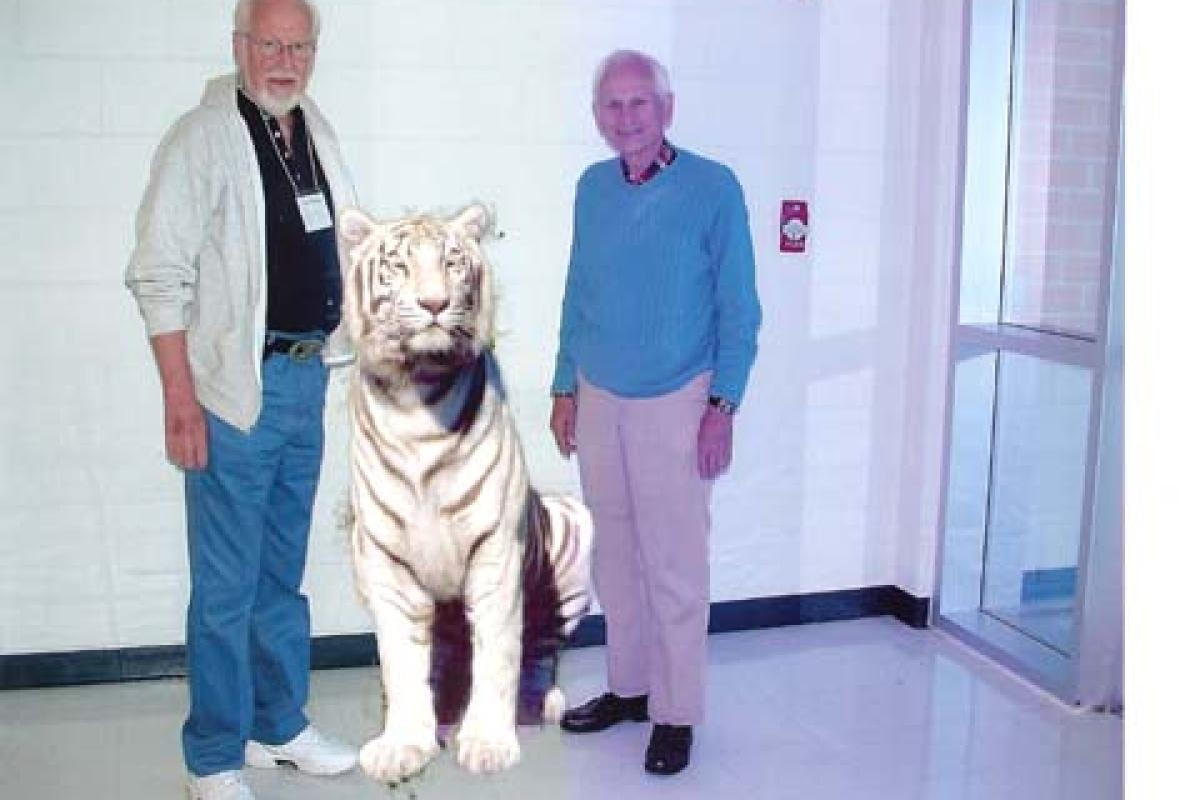 Two Men Standing with Edited Lion