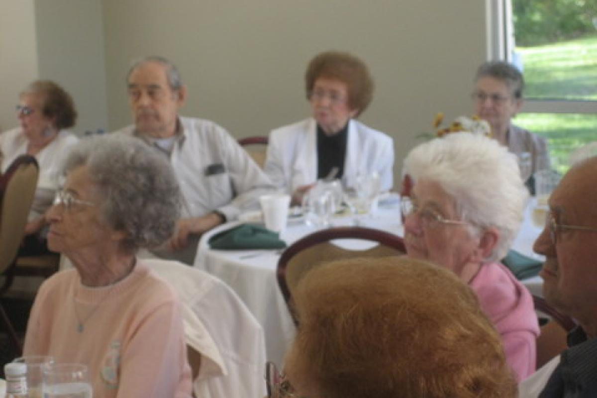 People at Tables Listening