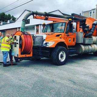 Vactruck Investigating a Sewer Stoppage